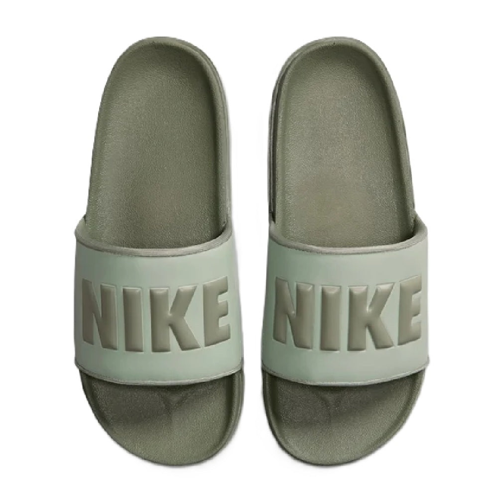 Nike slide sandal close-up of mint strap with NIKE lettering on green footbed