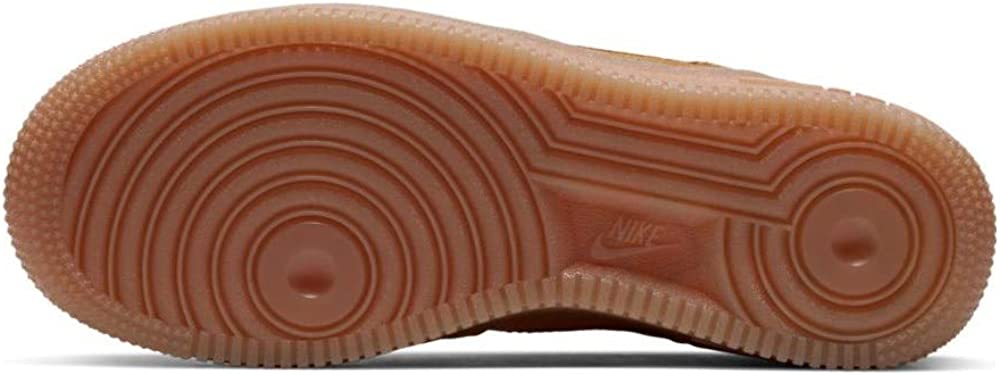 Big kids' Nike Air Force 1 gum rubber outsole with circular traction pattern.