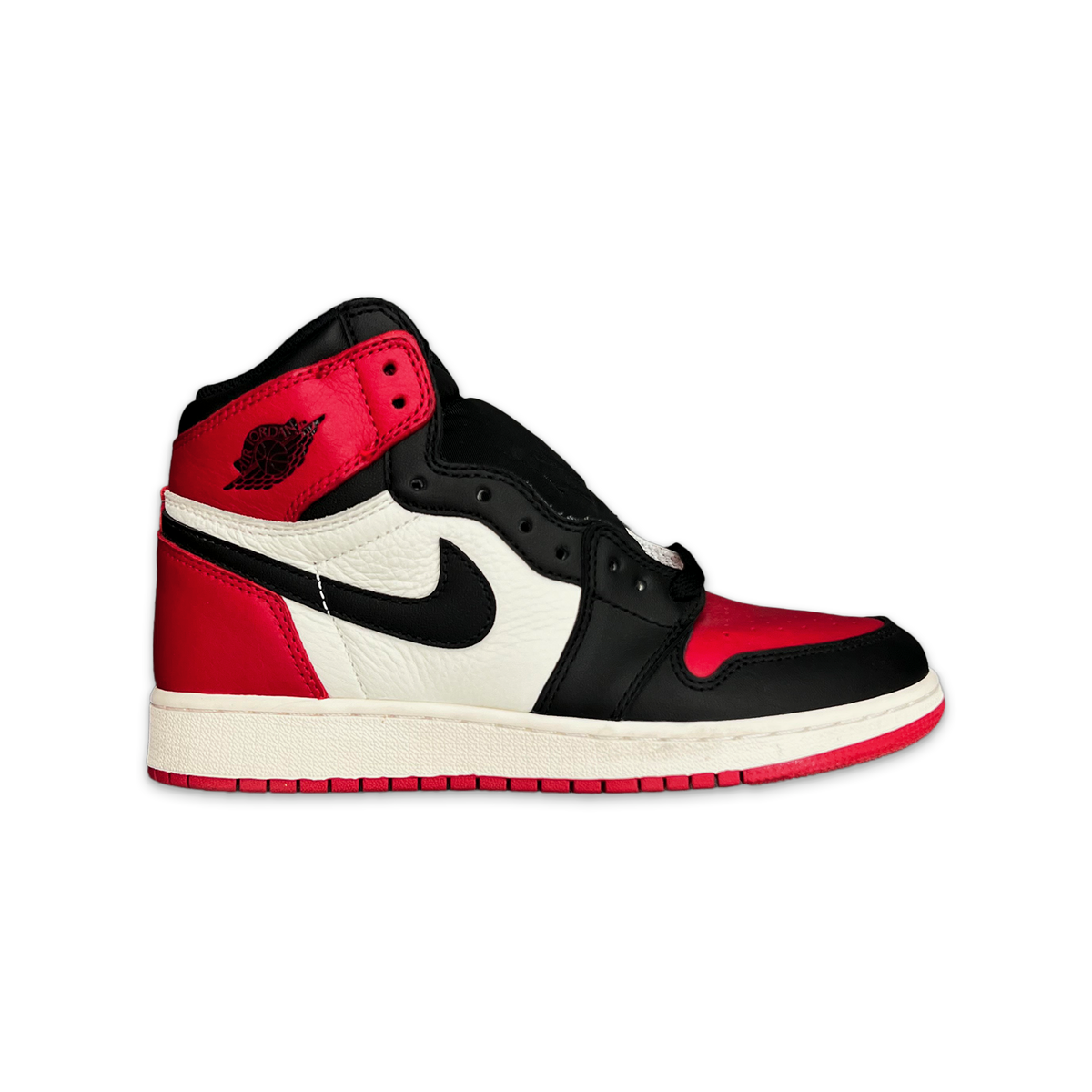 Kids Air Jordan 1 Retro High OG sneaker with red, black, and white panels