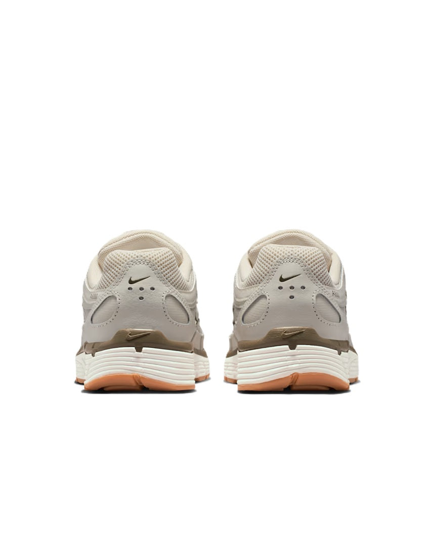 Women's Nike P-6000 sneakers, light bone with rear heel tabs and orange outsole