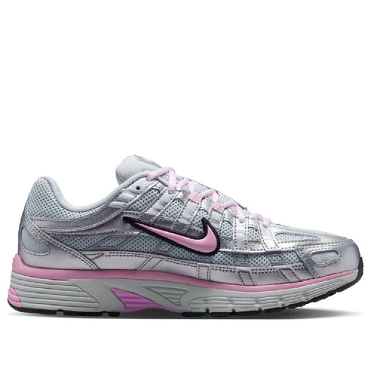 Nike women's running sneaker in silver and pink, lace-up with black Swoosh