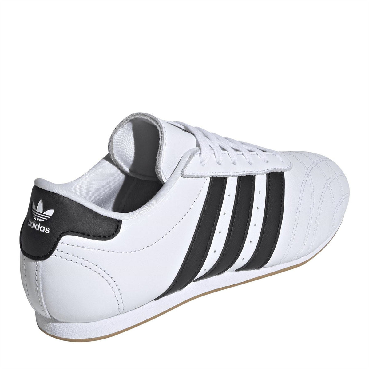 adidas Originals Taekwo low top sneakers in white with black accents, showcasing their stylish leather design and laces.