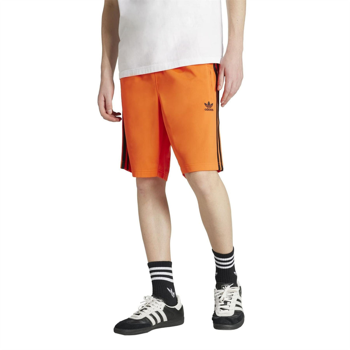 adidas Originals Adicolor Firebird Shorts in vibrant color with elastic waistband and iconic three-stripe design, front view