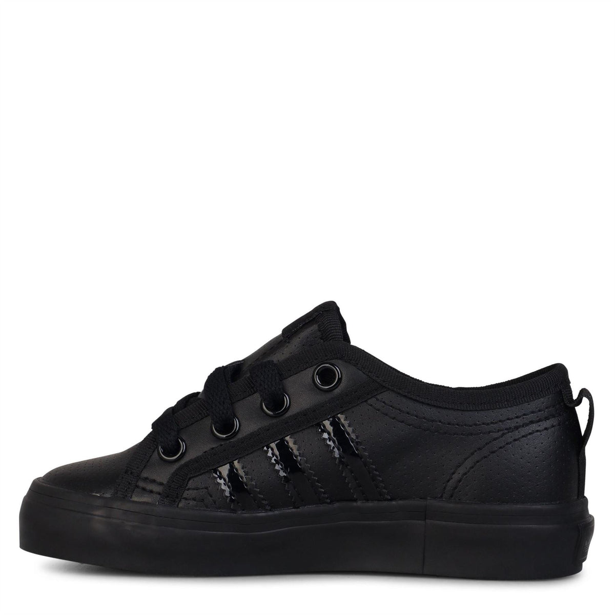 Children's adidas Originals Nizza Low Top Sneakers in size 10-2, featuring classic white canvas and rubber soles.