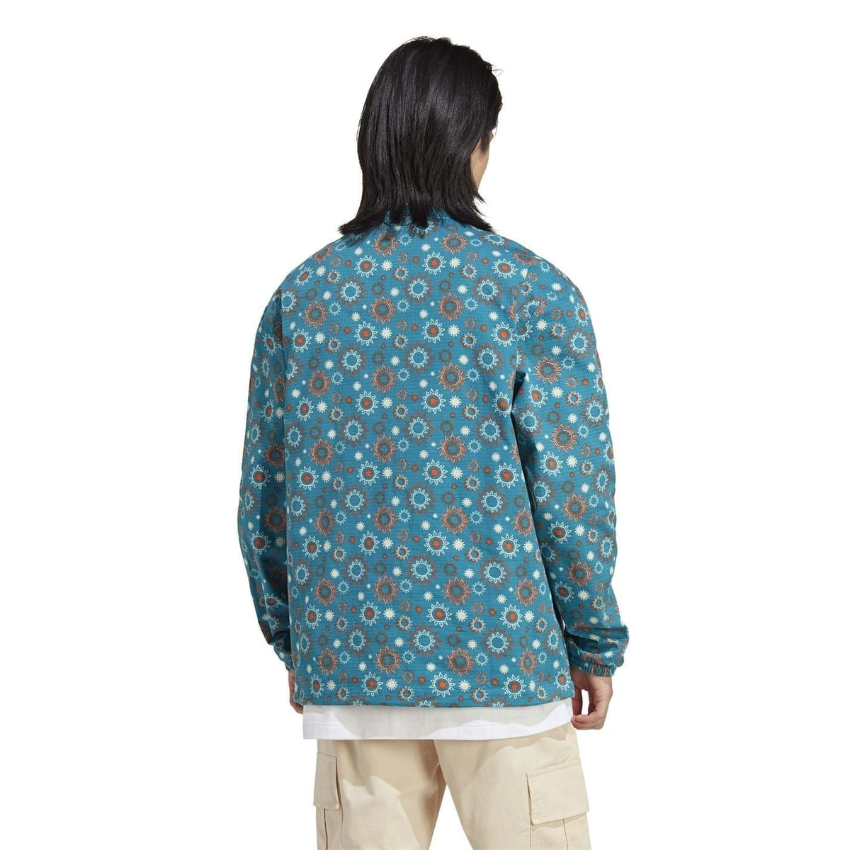 adidas hooded quarter-zip relaxed shirt, back view in teal floral print with logo patch