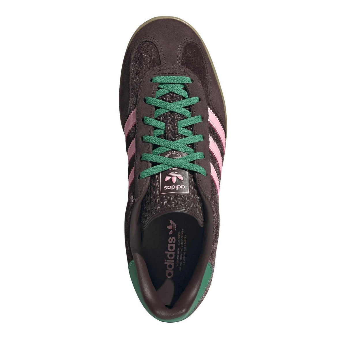 Dark brown indoor trainer with green laces and adidas tongue label visible