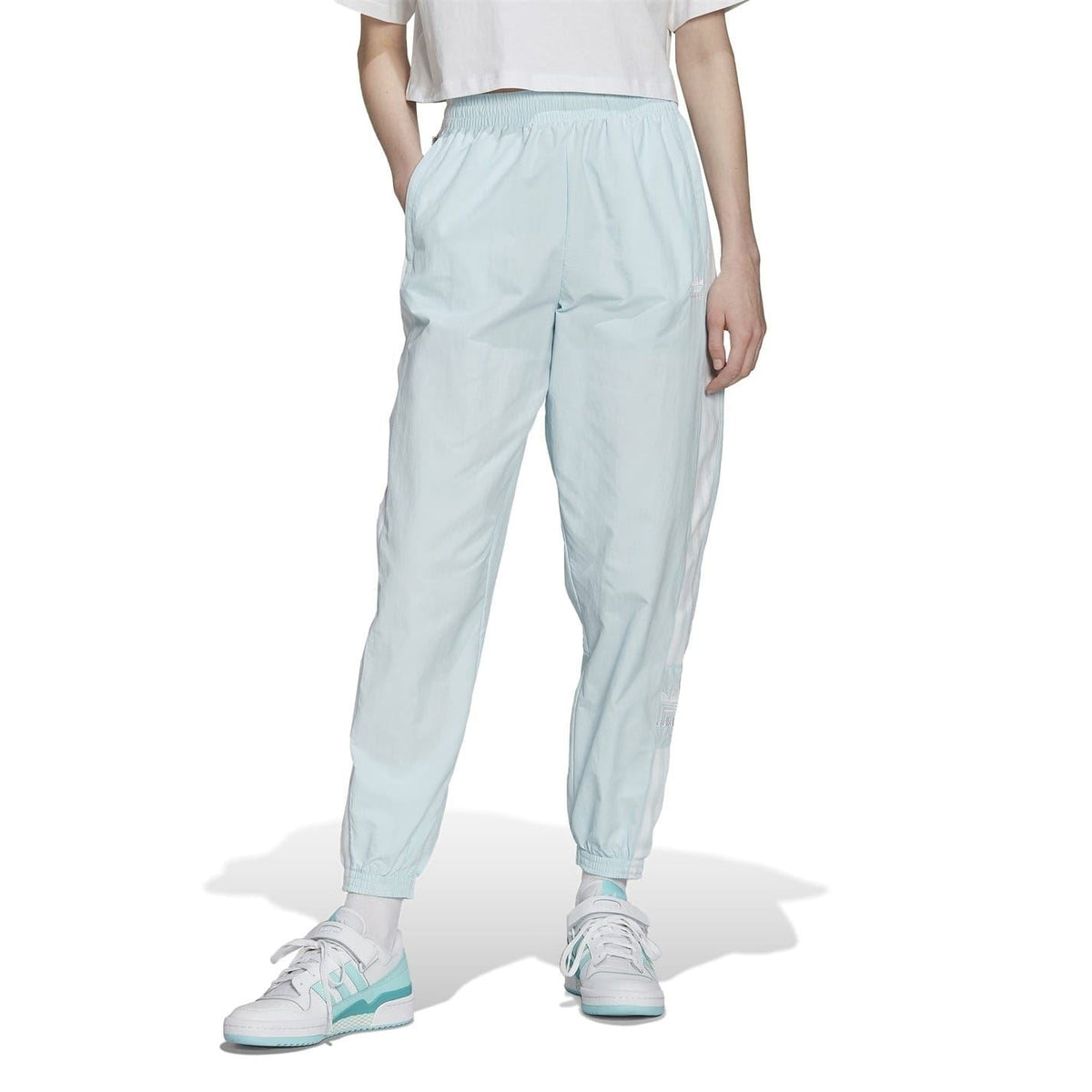 Light blue track sweatpants with tapered jogger legs and elastic waistband