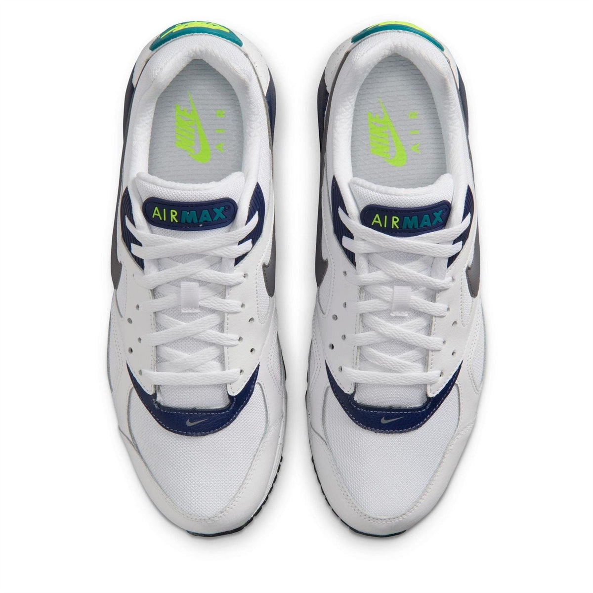 Air Max Ivo trainers front view in white with navy panels and lime green Air Max text.