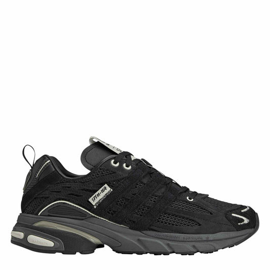 adidas Originals Cushion STFM Trainers in black with white soles, showcasing sporty athletic footwear design and branding.