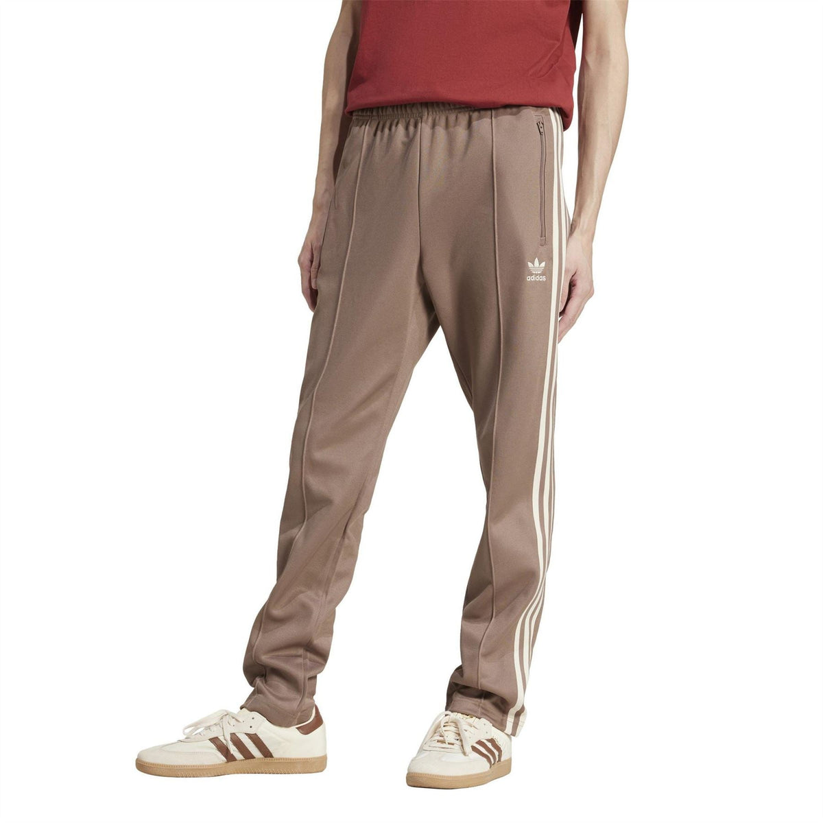 adidas Originals track pants with white side stripes and elastic waist, trace brown