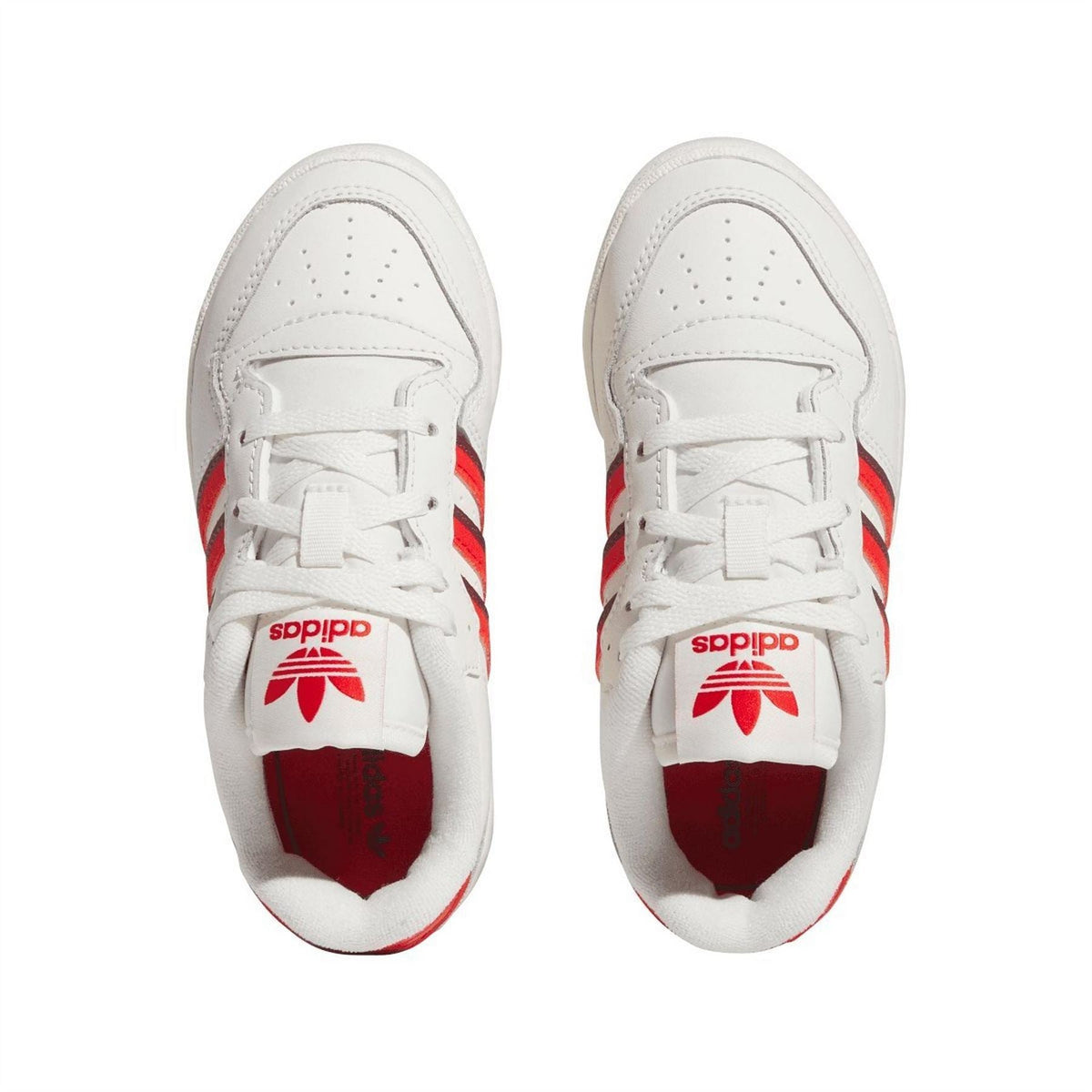 Pair of white low-top trainers with red tongue logo and lace-up fronts