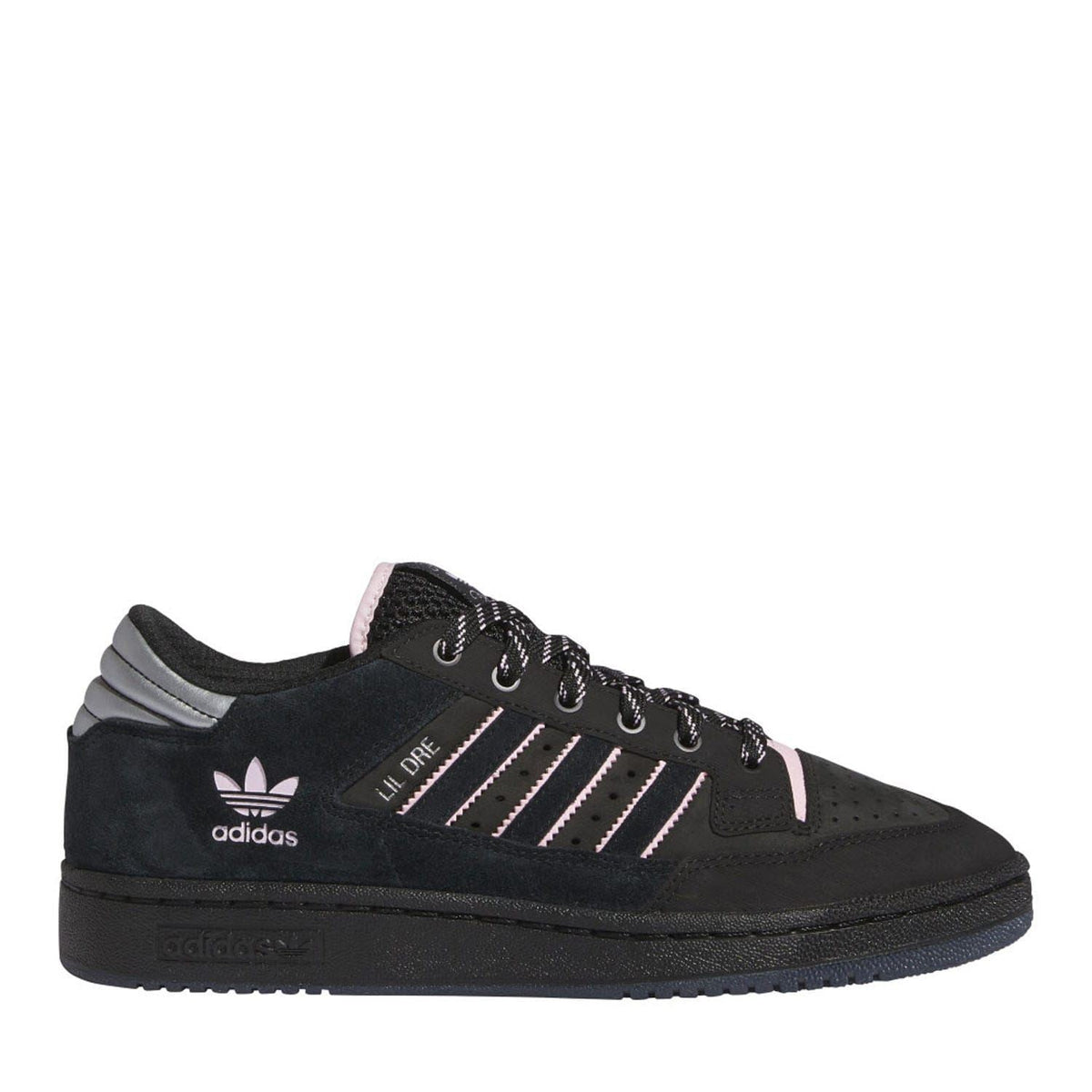 Black low-top trainers with pink accents, three stripe logo, and lace-up front