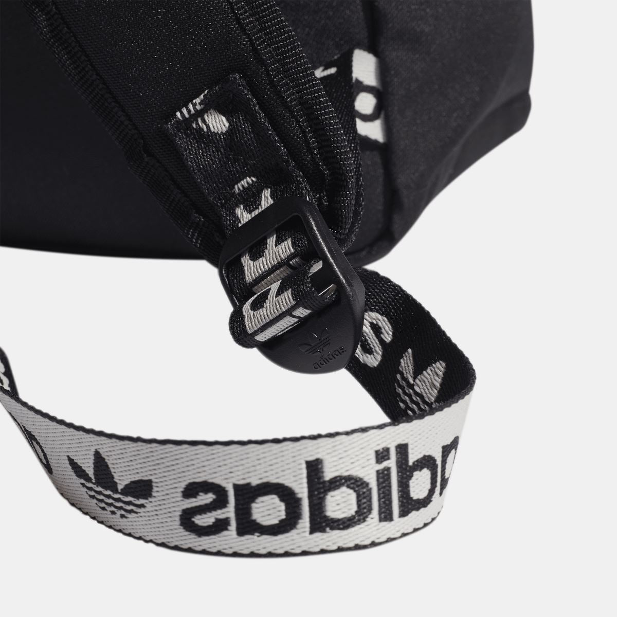 Black Adidas Originals Adicolor backpack with patterned strap webbing and adjustable buckle
