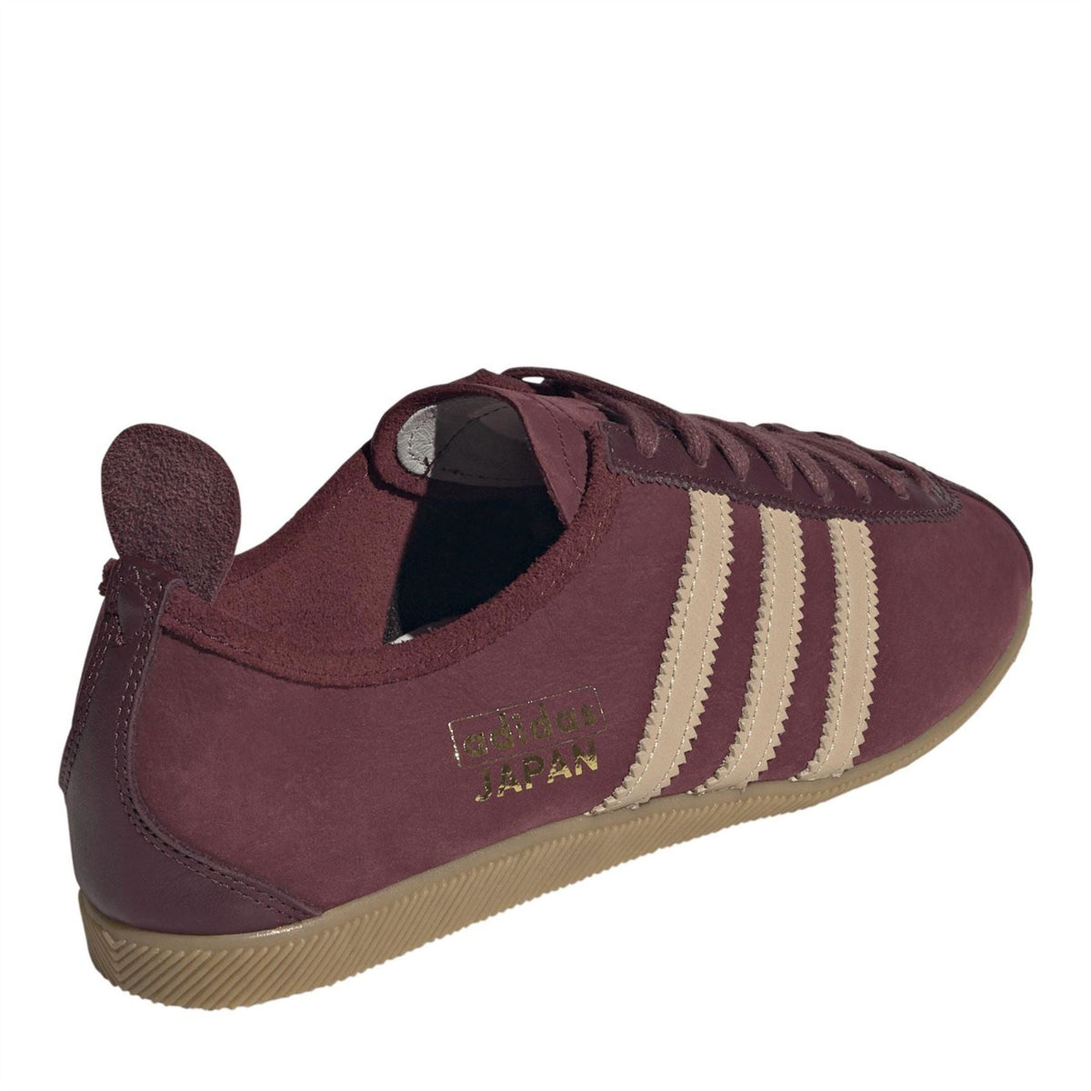 Men's burgundy low-top trainers with lace-up, suede-style finish, and Japan patch