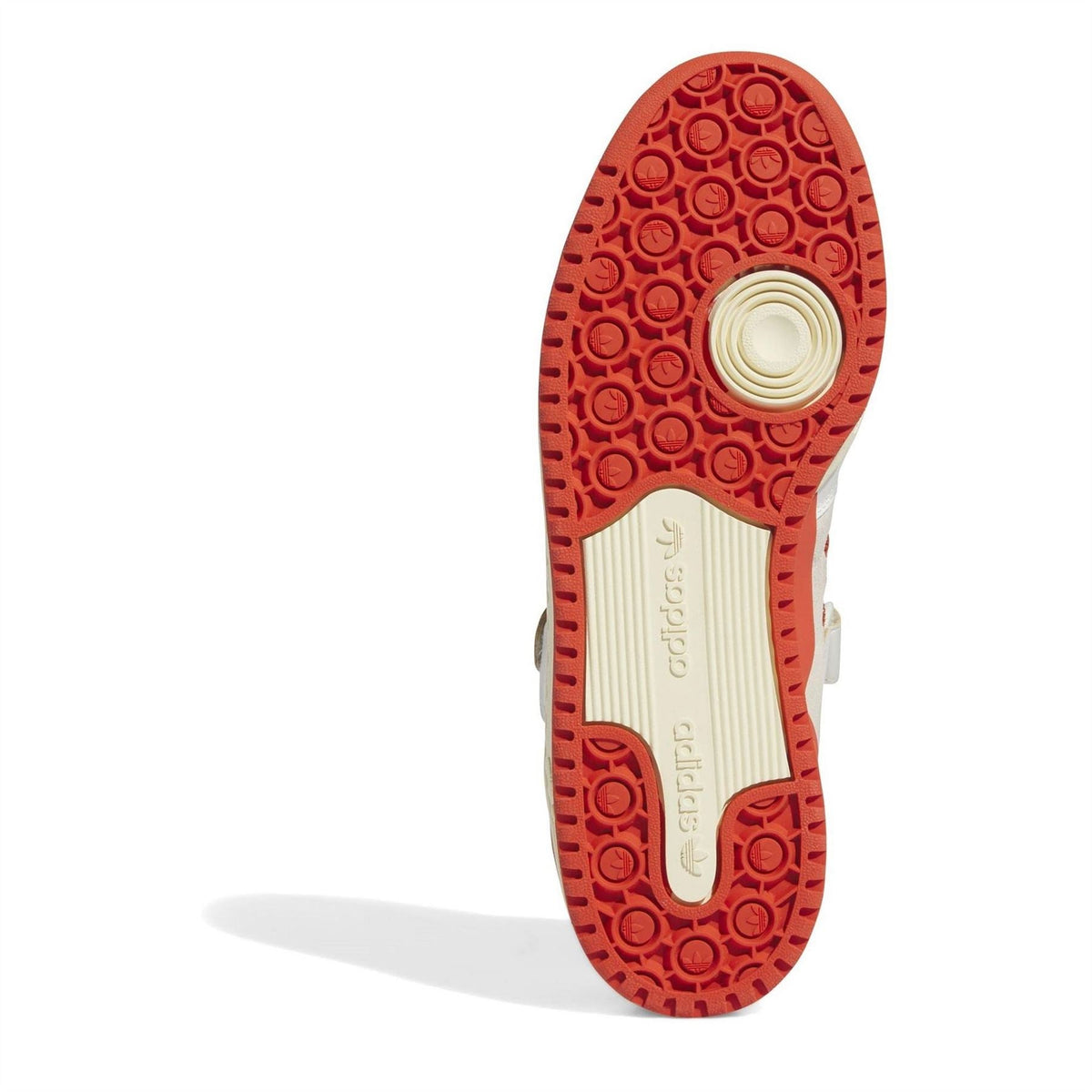 Low-top sneakers: red tread outsole with circular grip pattern