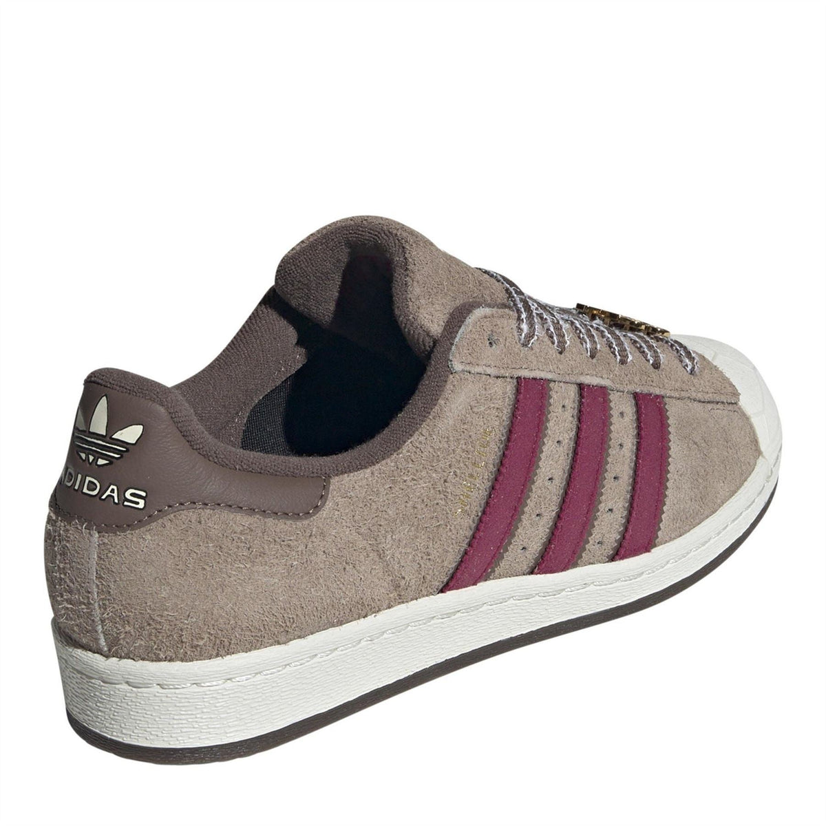 adidas Originals sneakers with taupe suede, maroon stripe accents, and adidas logo at heel