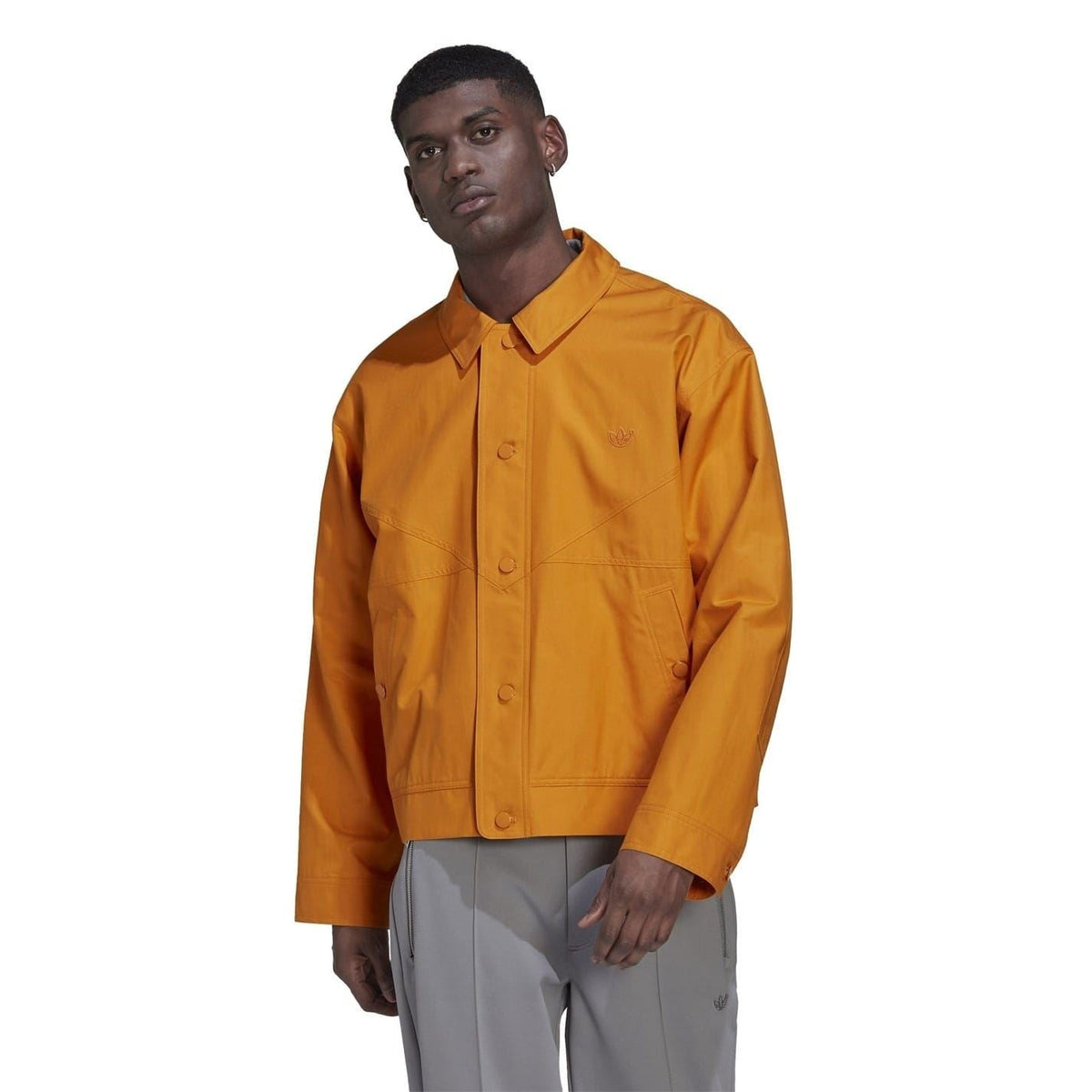 adidas Originals Tie Break jacket, a stylish men's coat with a sporty design, featuring a zip-up front and lightweight fabric.