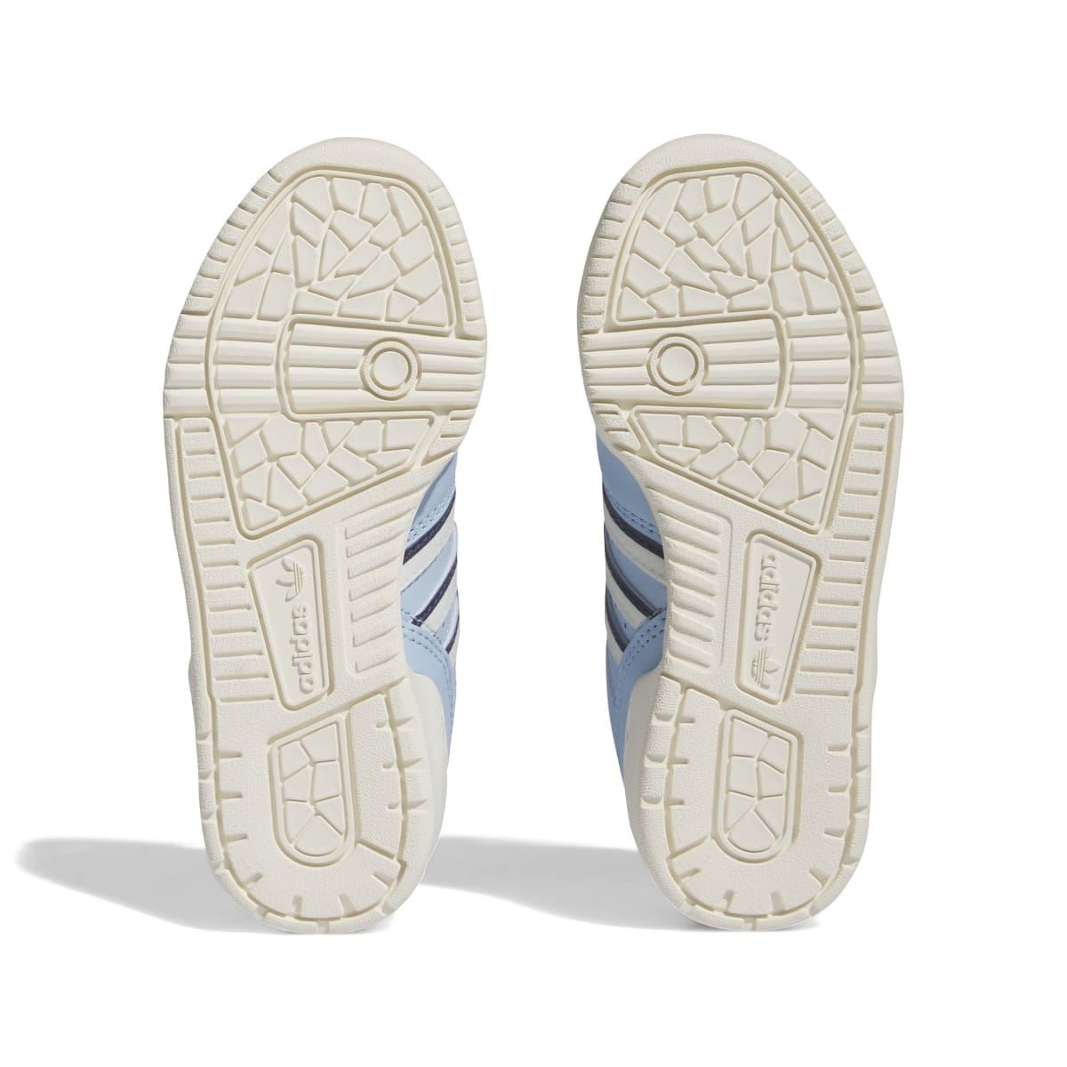 Kids' light blue low-top trainers, outsole view with textured tread