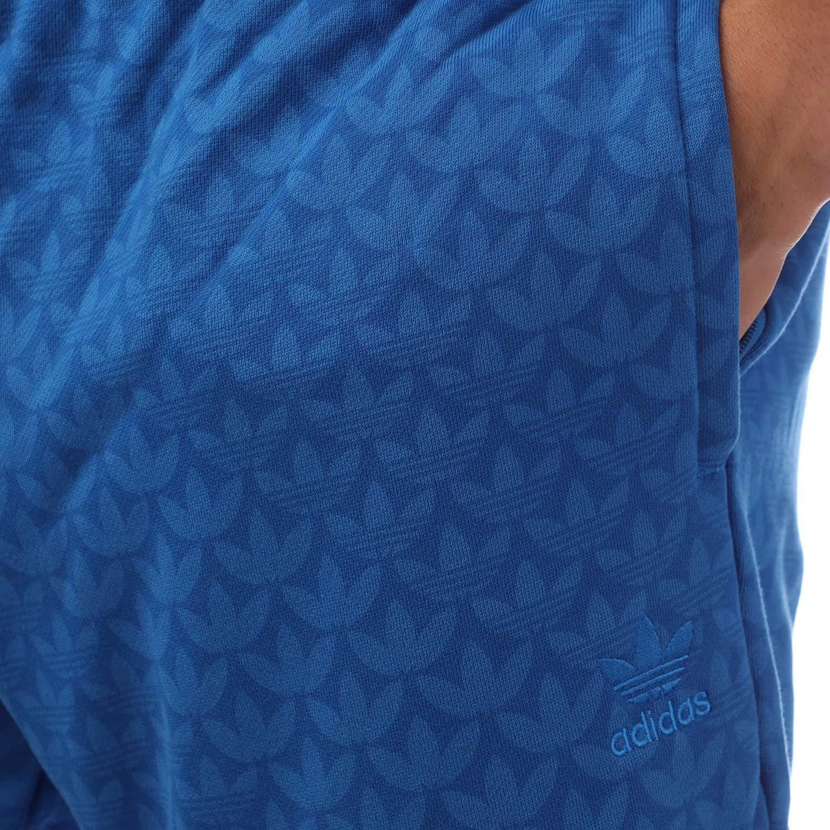 Blue adidas monogram graphic shorts with adidas logo on leg