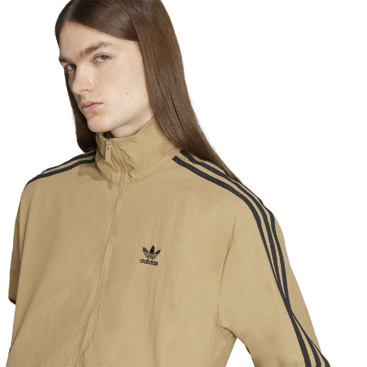 Tan high-neck zip athletic top with adidas logo and navy shoulder stripe accents.