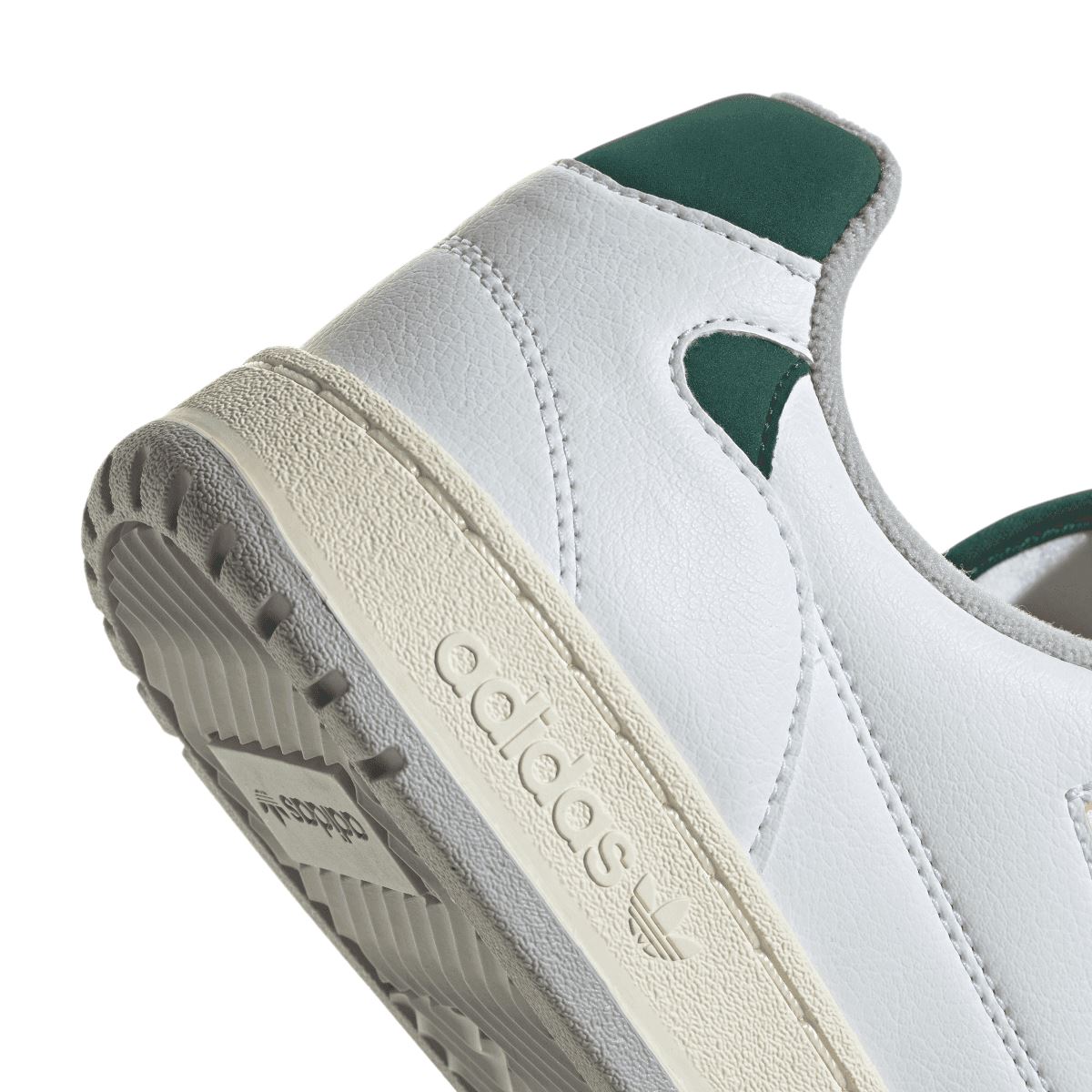 Close-up of adidas NY 90 heel and outsole with textured tread and beige cushioning
