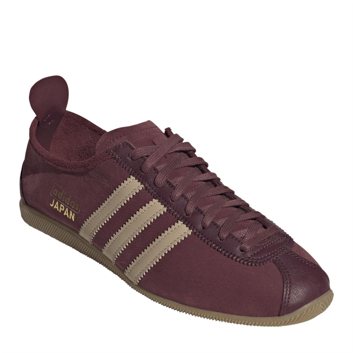 Men's burgundy low-top sneakers with lace-up, stitched overlays, and Japan logo