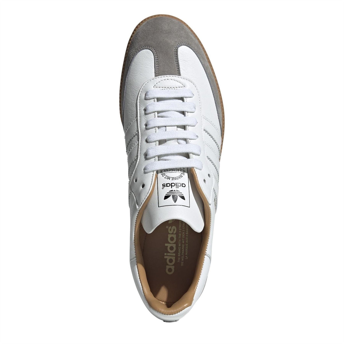 White lace-up sneakers with gray toe and side panels, gum interior detail