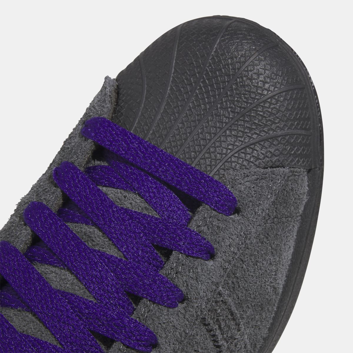 adidas Originals Superstar ADV shoes in white with black stripes, classic sneaker design, shown from side view