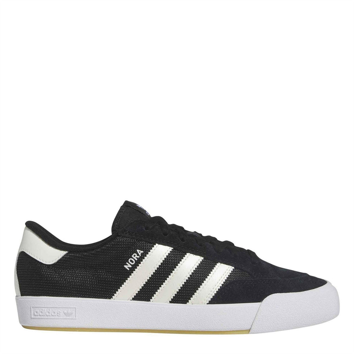 Black low-top trainers with white adidas stripes and white rubber sole
