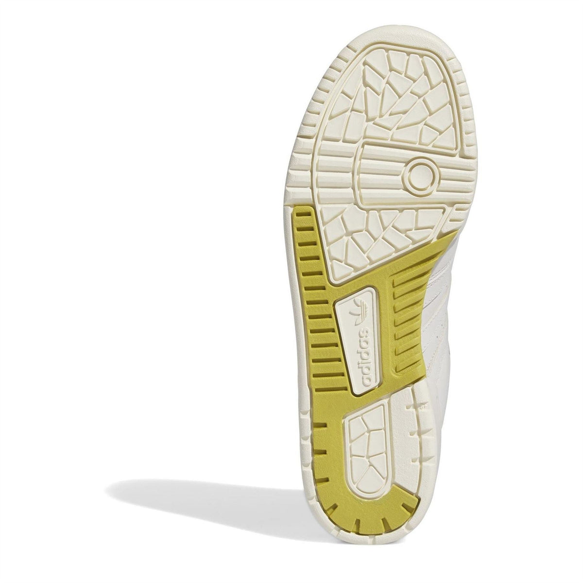 White rubber outsole with yellow traction pods and circular adidas emblem