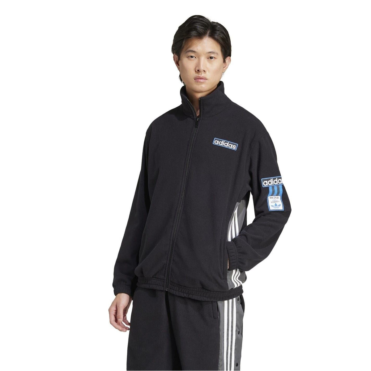 Black adidas funnel-neck zip-up sweatshirt with sleeve logo patch
