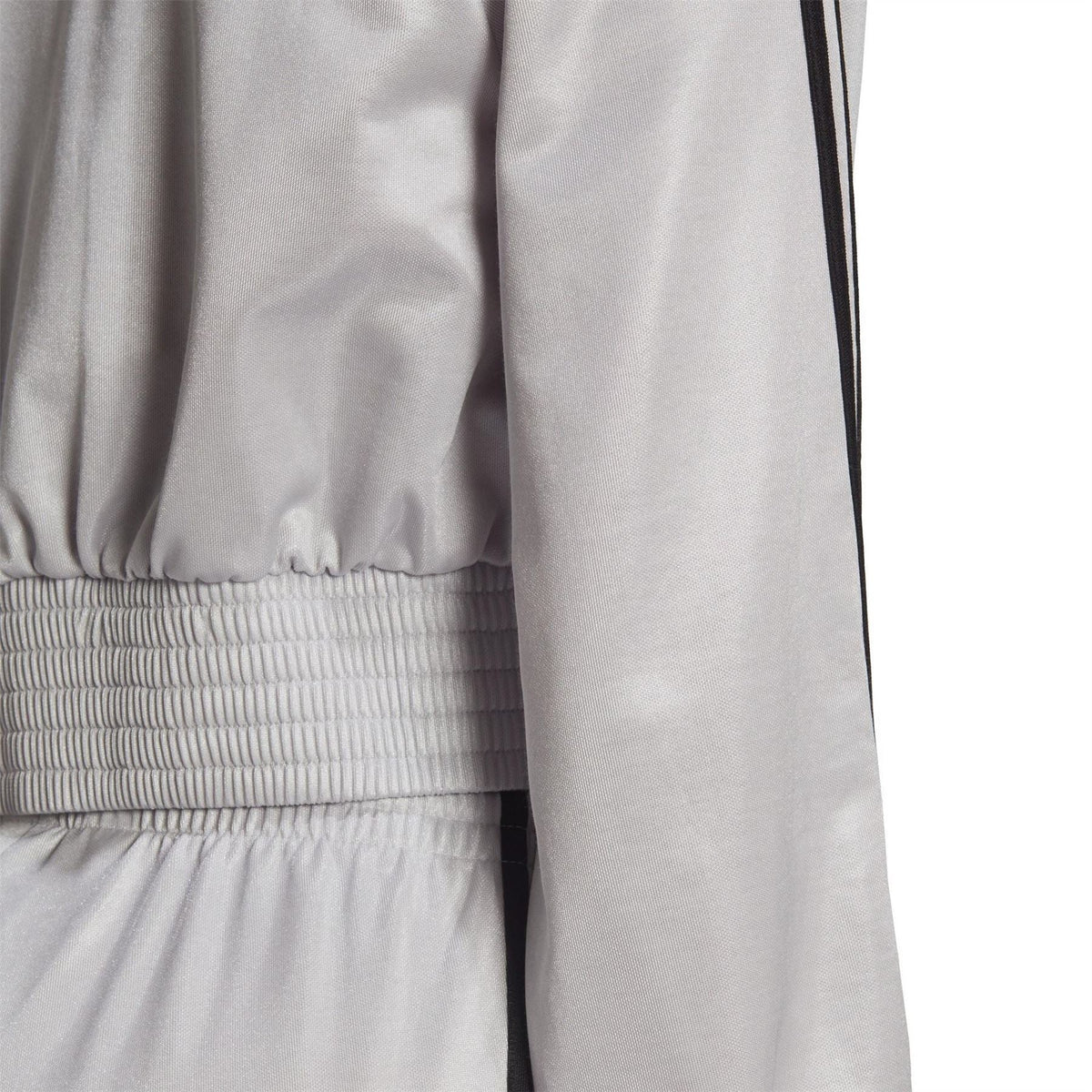 Silver track top with ribbed cuffs and elastic waist hem, plus black side stripe