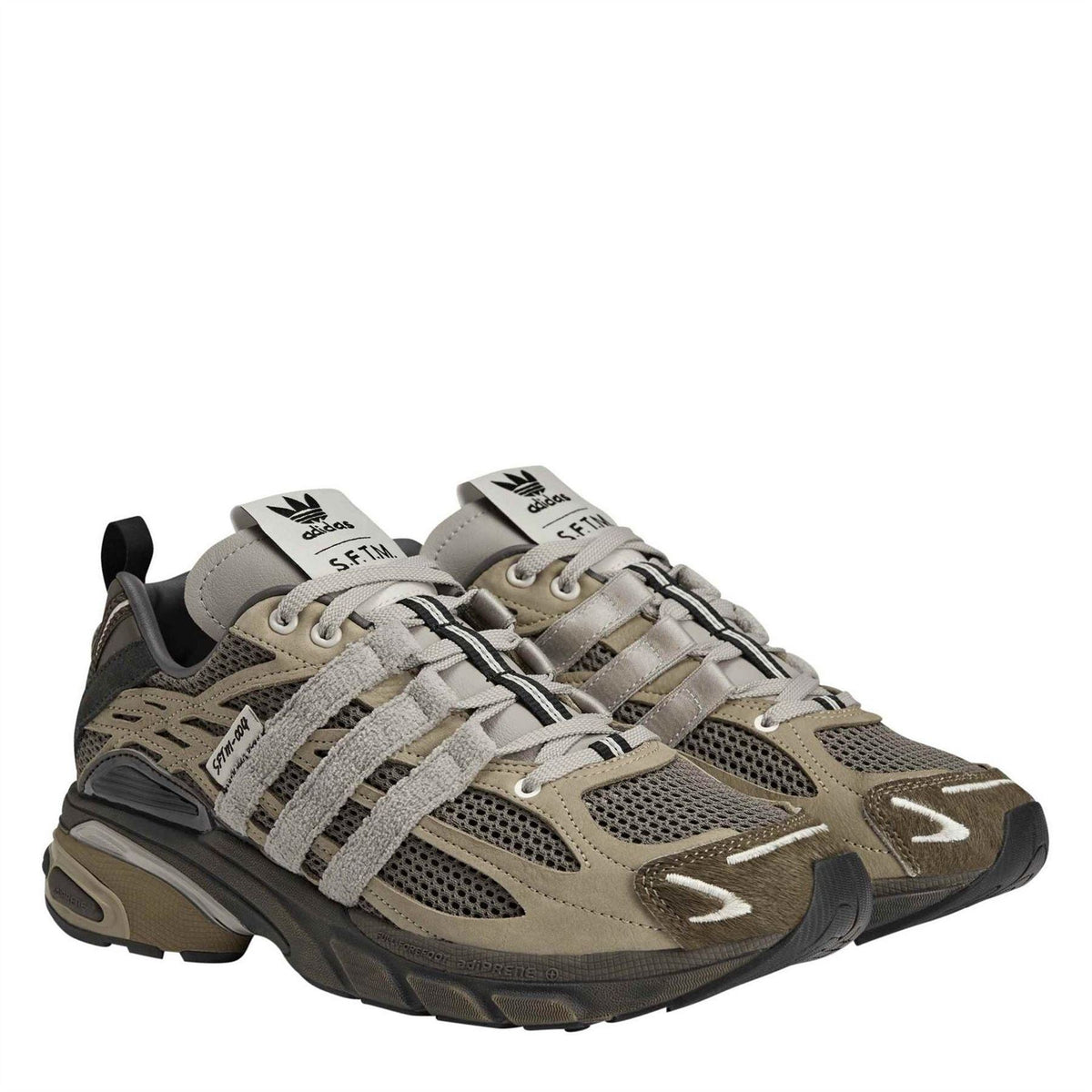Tan low-top walking shoes with lace-up closure and textured mesh upper
