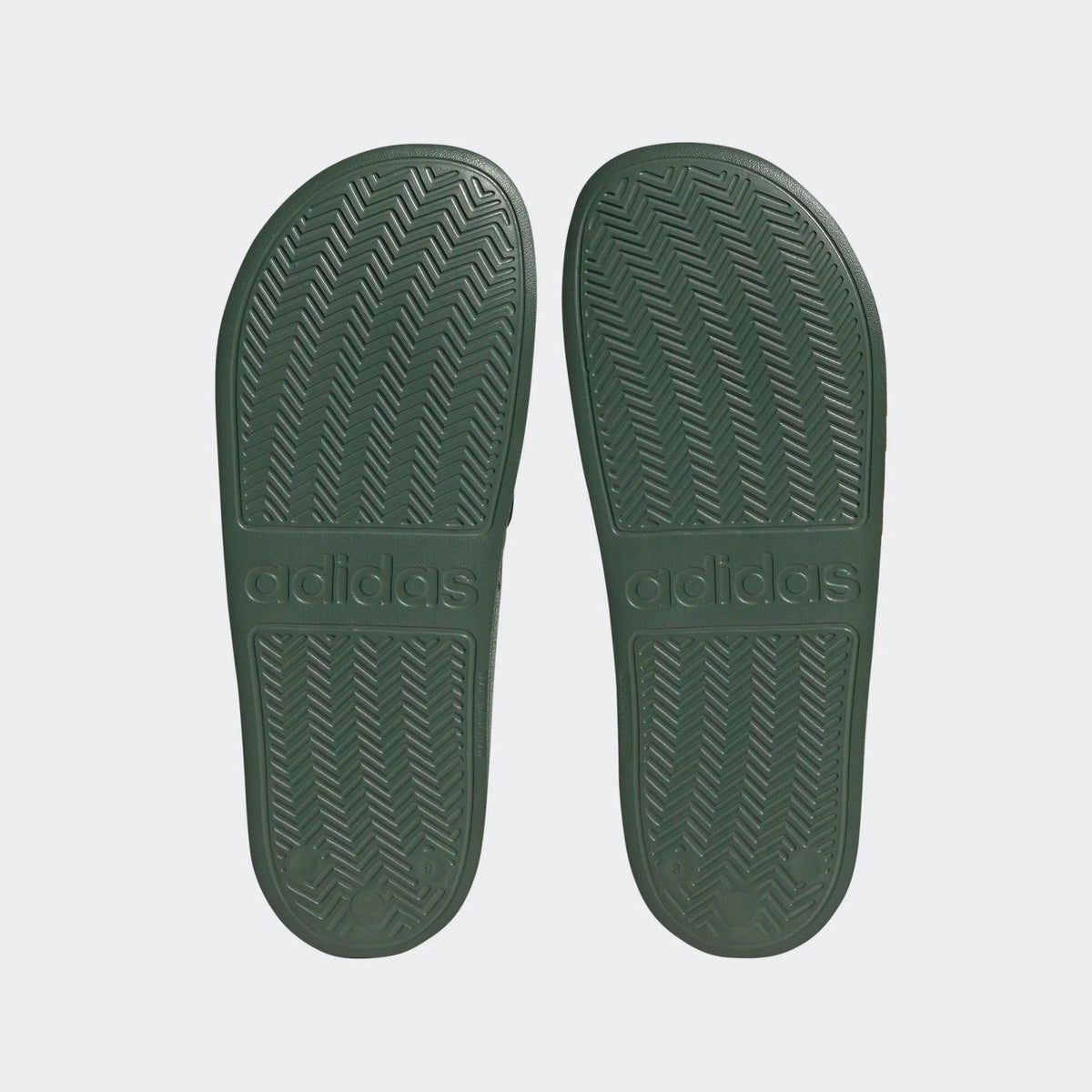 Adilette shower slides outsole, dark green tread with adidas logo