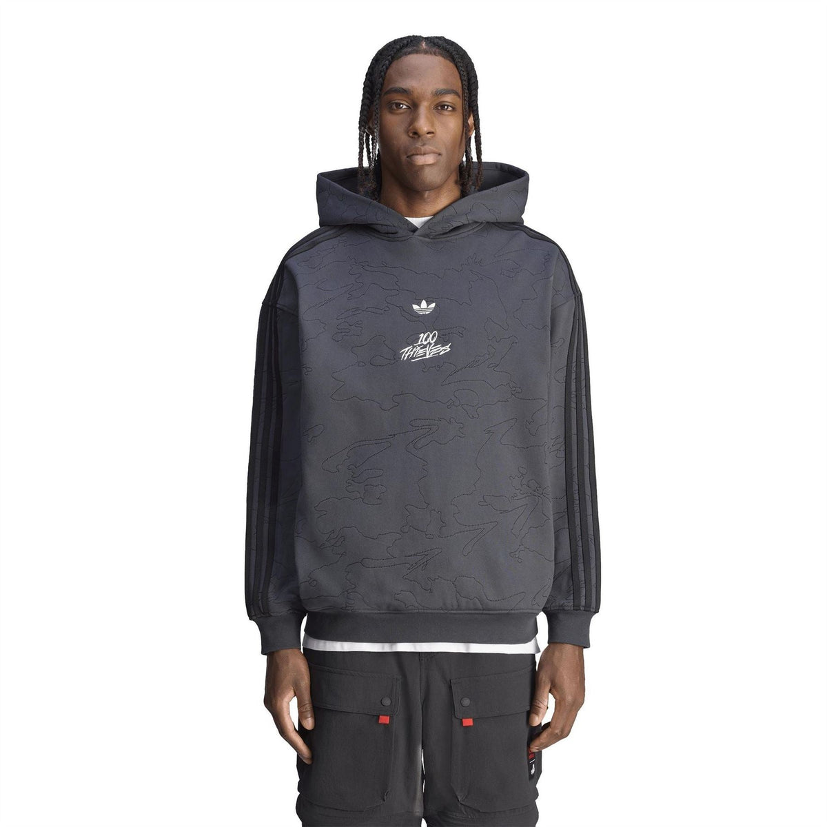 adidas Originals 100t hoodie on model, dark carbon pullover with embossed front print