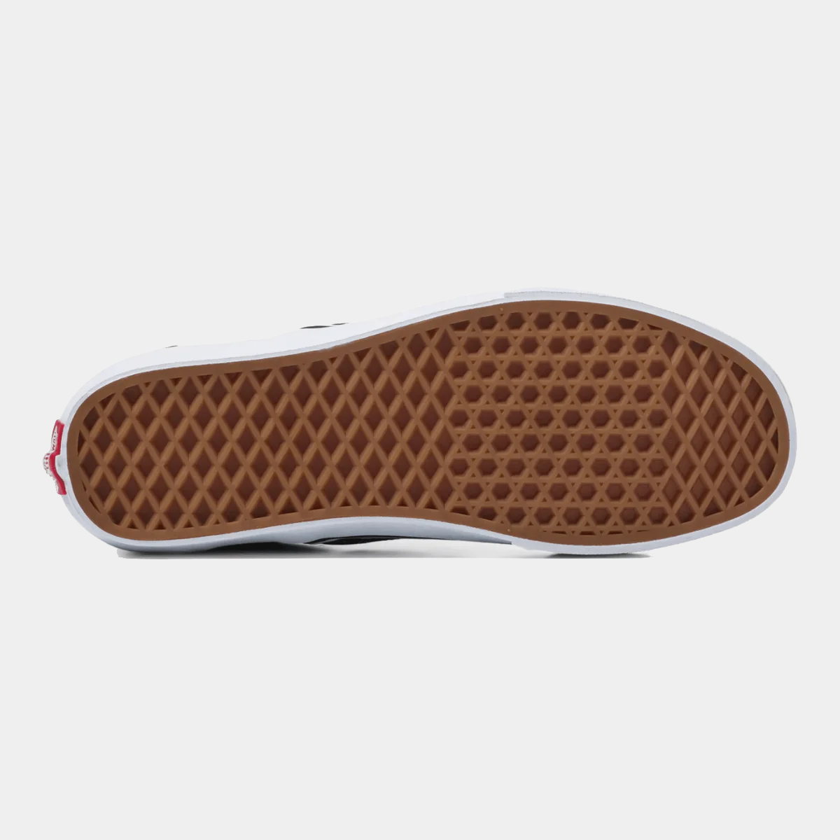 Brown rubber outsole of a slip-on checkerboard sneaker with tread pattern