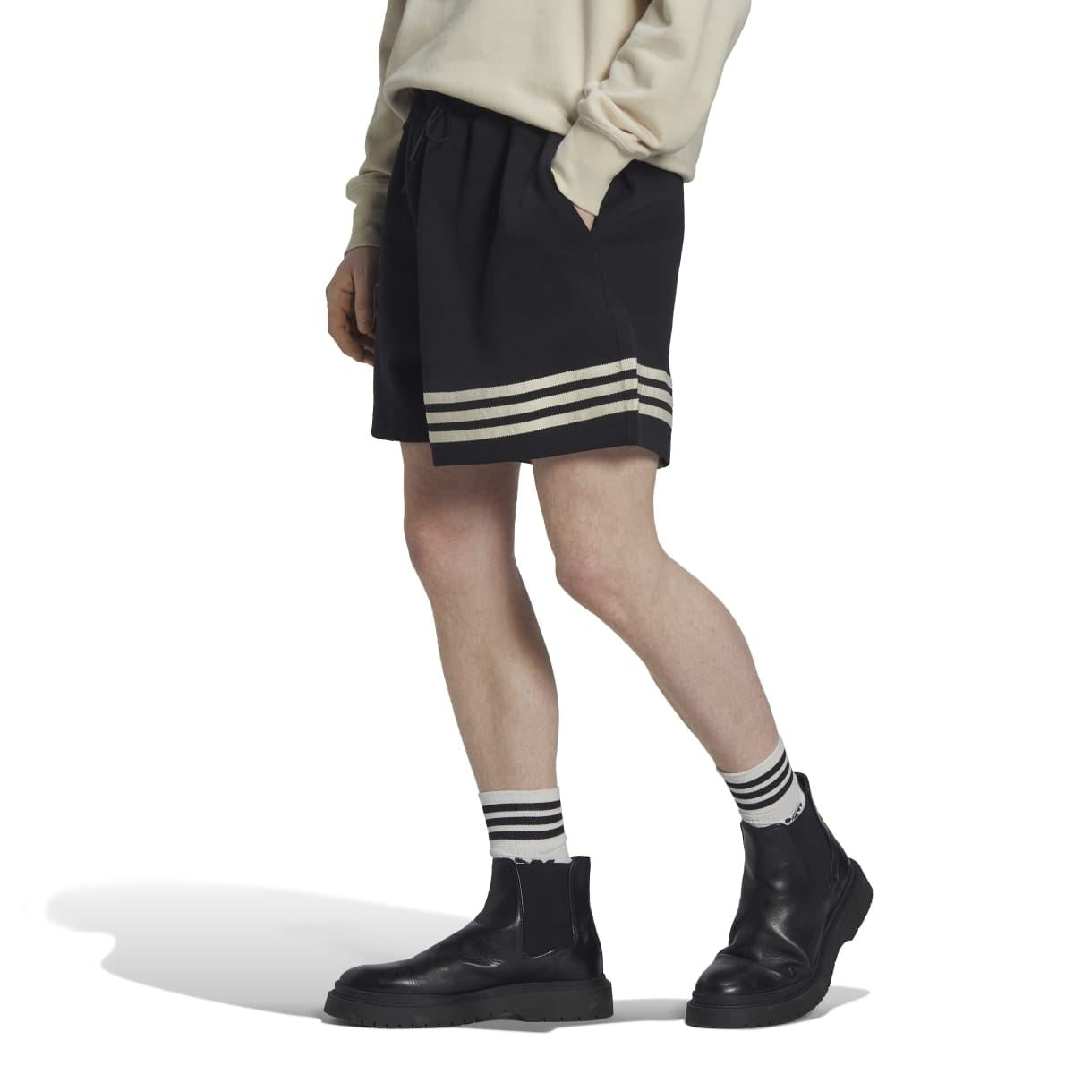 Black drawstring shorts with elastic waistband and three striped band at the hem