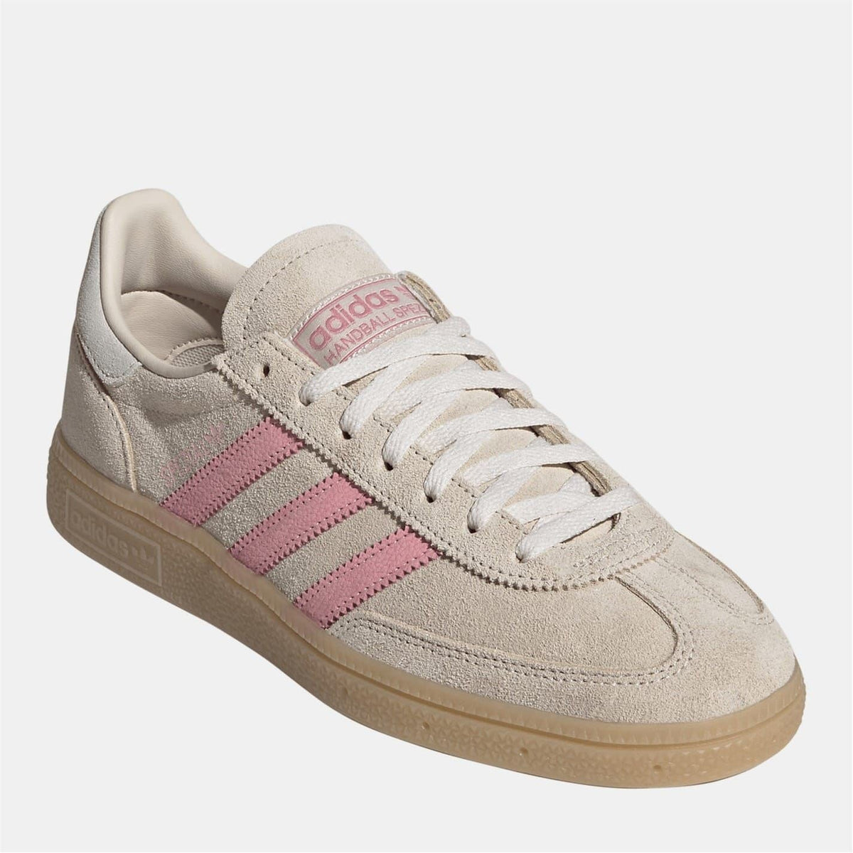 Beige suede Adidas Spezial sneakers for women with pink stripes and lace-up front.