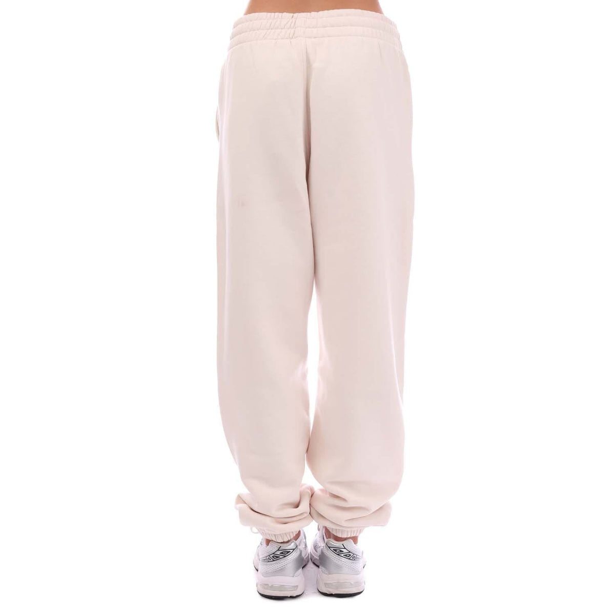 Off-white fleece joggers from back view, elastic waistband and tapered legs