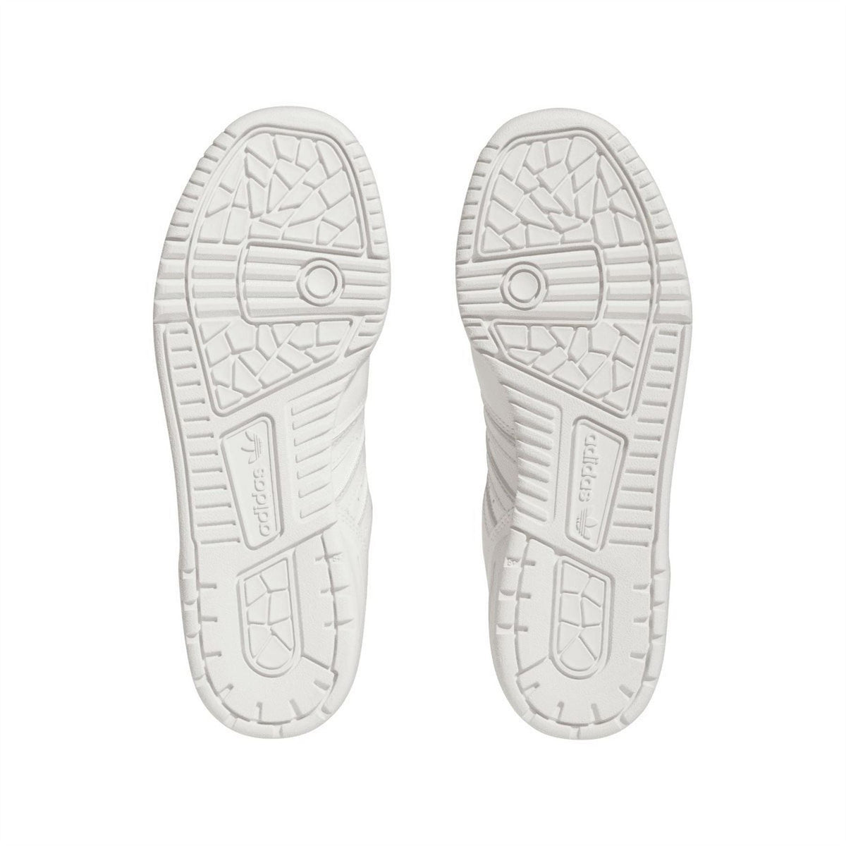 White sneaker outsoles with patterned traction and adidas Originals heel mark.