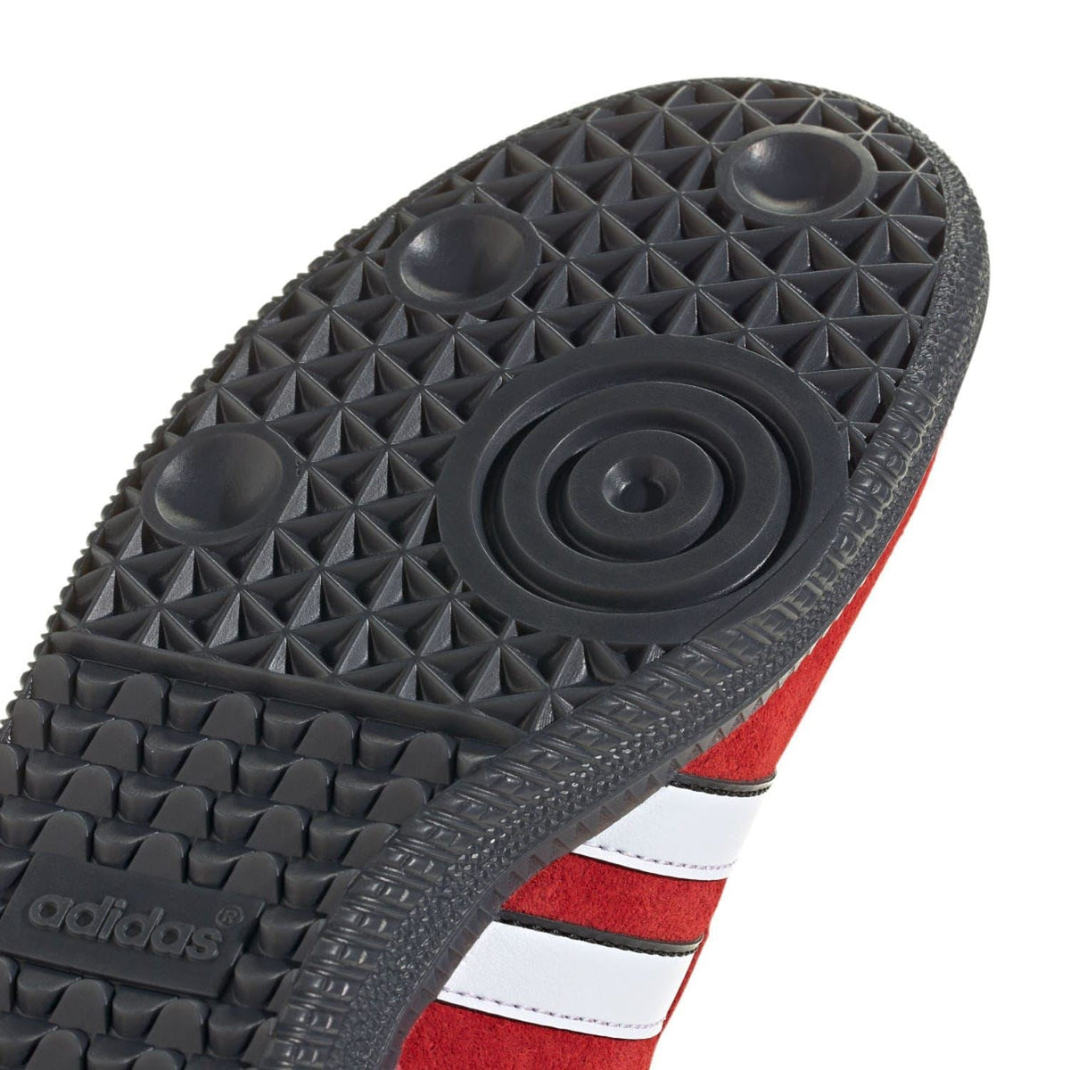 Textured black rubber outsole detail with circular grip pattern