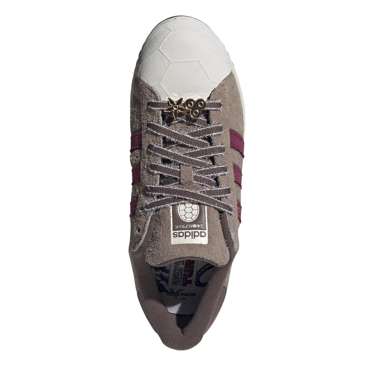 adidas Originals toe view sneakers with taupe suede upper, maroon stripes, and Adidas tongue logo