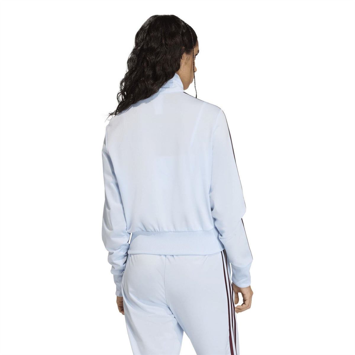 Light blue women’s track jacket with burgundy side stripes and elastic waist cuff.