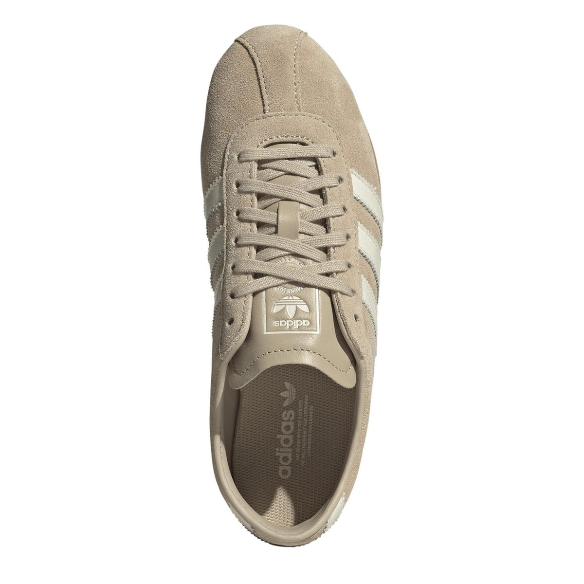 Stone khaki lace-up sneakers with textured sole and adidas logo patch at the tongue