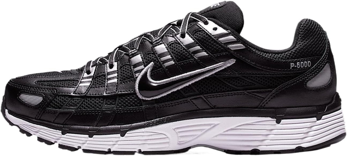 Nike P-6000 black sneakers with silver Swoosh, lace-up front, chunky white midsole.