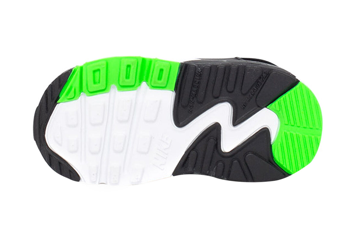 Toddler sneaker outsole view with black tread and neon green heel accent