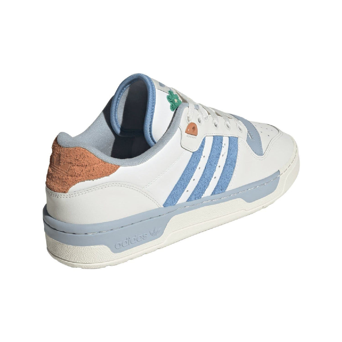 White low-top trainers with blue stripe side, blue heel lining, and brown collar