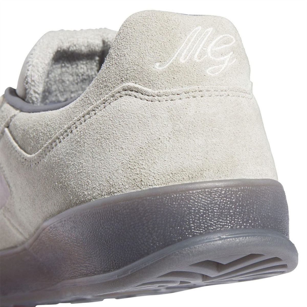 Beige adidas Originals Super Trainers heel close-up with stitched logo on suede upper