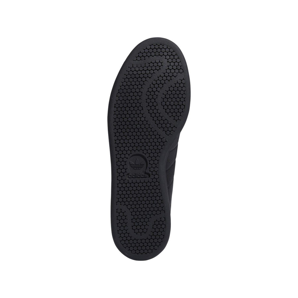 Black textured rubber outsole with circular grip pattern and logo