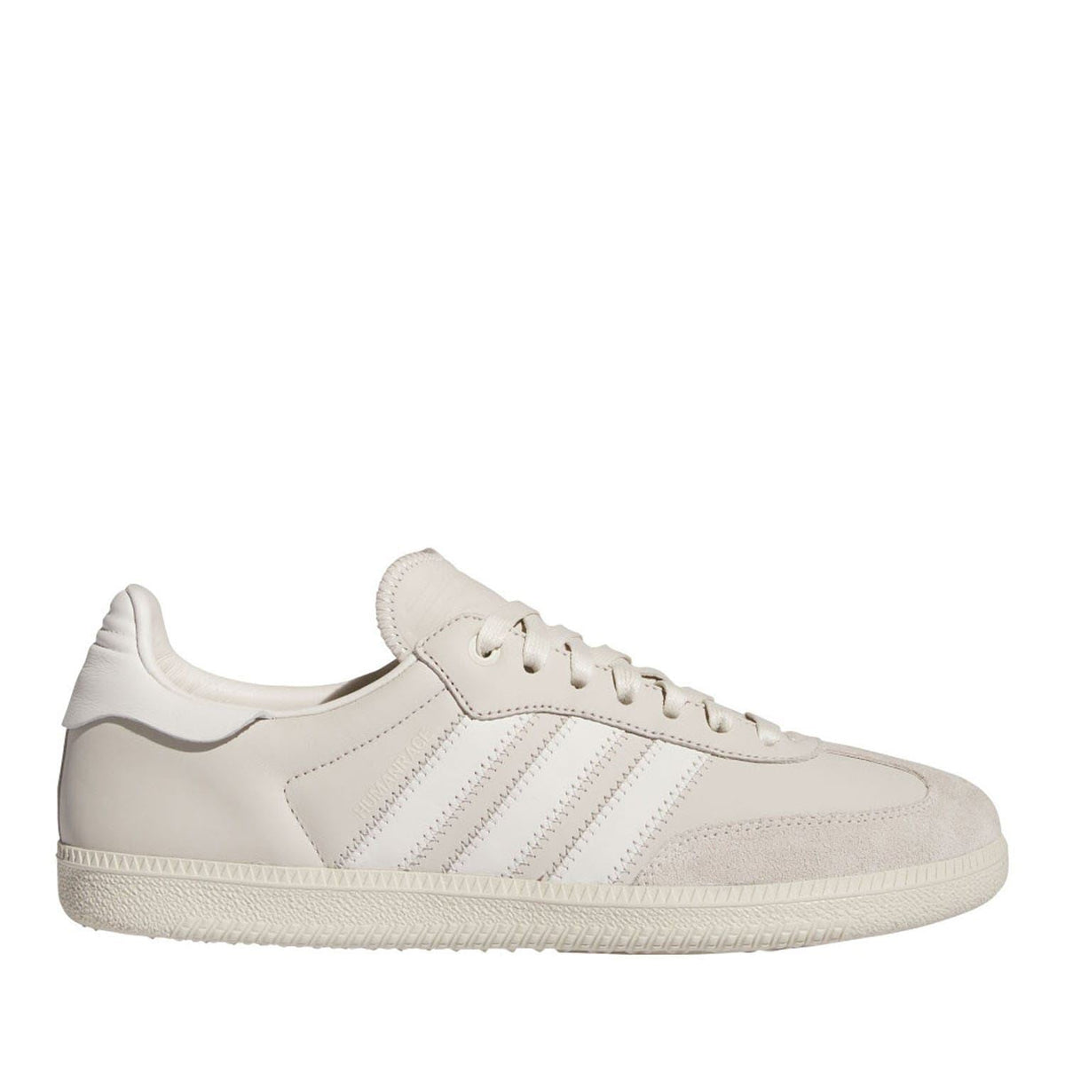 White low-top Samba-style trainers with lace-up closure and three side stripes